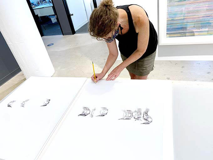 Cattie Coyle signing Sandpiper prints at Boston Art