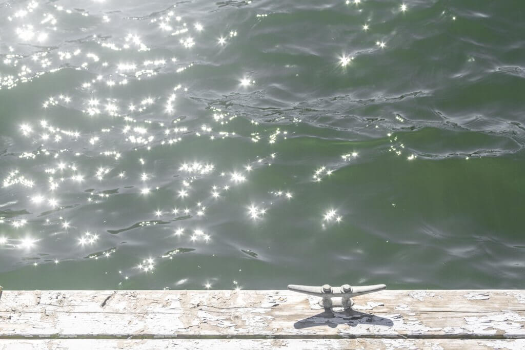 Dock and sun glitter by Cattie Coyle Photography