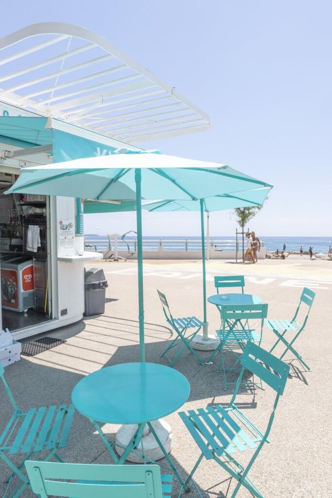 Turquoise tables, chairs, and umbrellas, Plage du Midi, Cannes, France | Cattie Coyle Photography