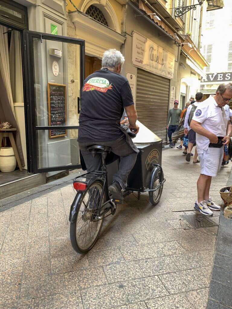 Chez Theresa socca being delivered by bike, Nice France | Cattie Coyle Photography