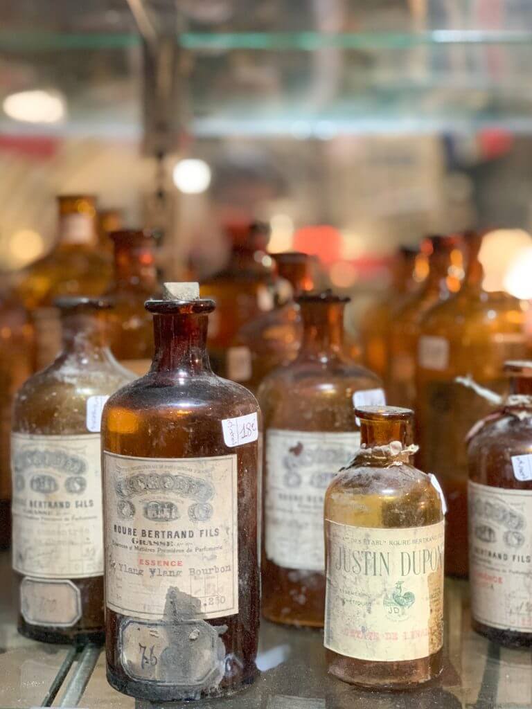 Old glass bottles at L'usine Centre D'Antiquite Brocante, Menton, France, by Cattie Coyle Photography